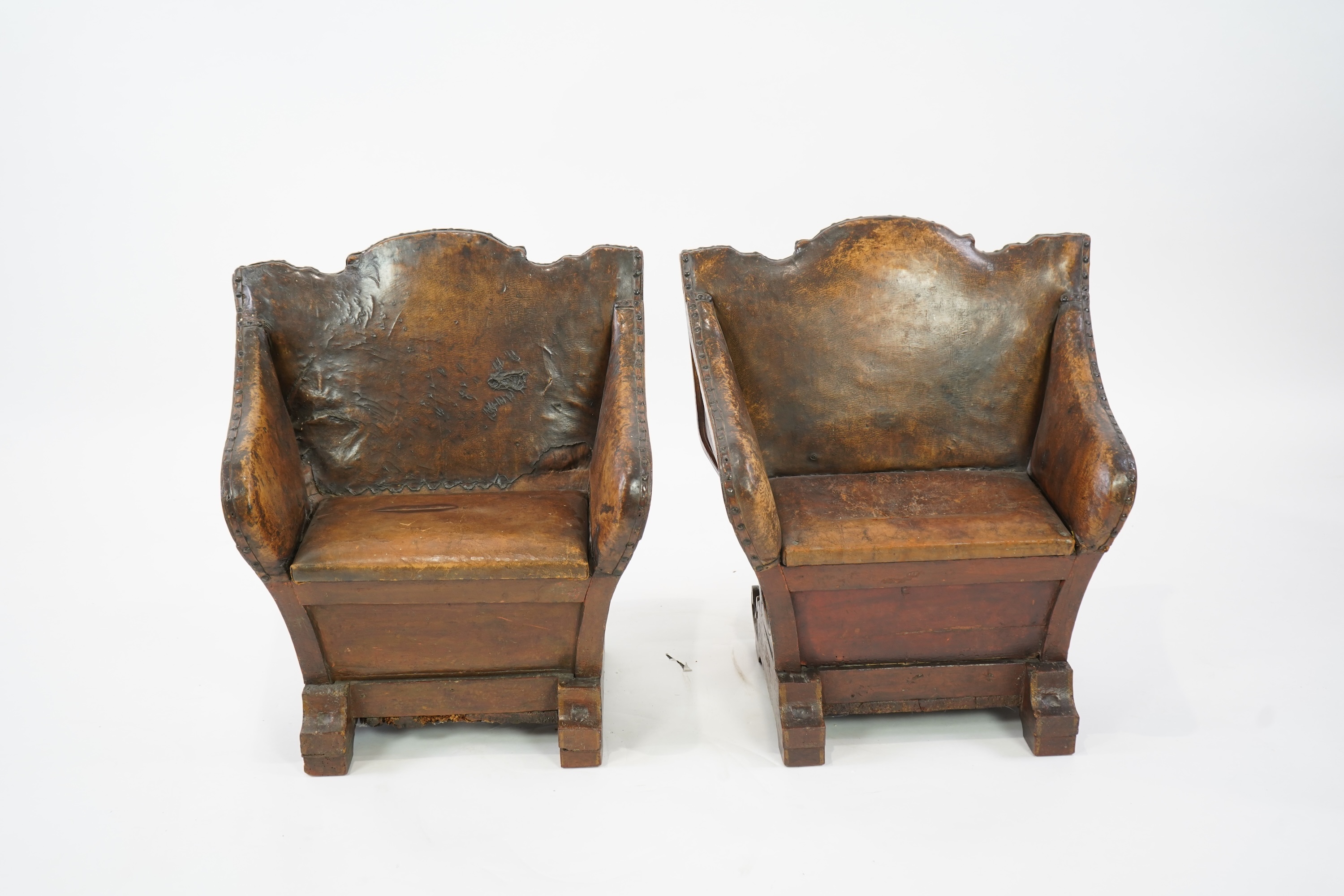 A pair of 19th century Venetian carved wood and tan leather Gondola seats